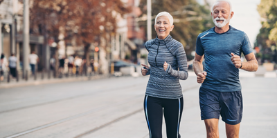 Senior couple jogging together to stay fit