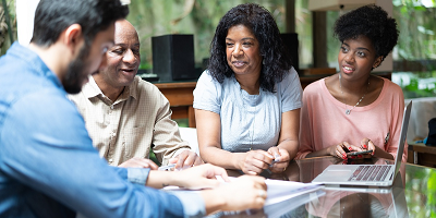 Advisor talking with clients