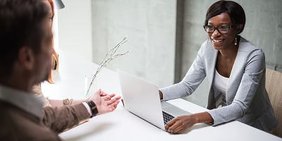 Female insurance agent with meeting with clients
