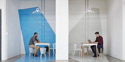 Two male workers sitting at desks
