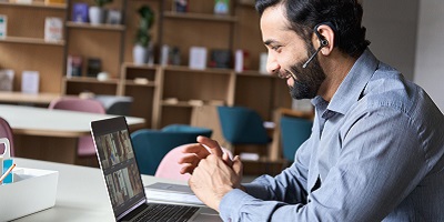 A financial advisor holds a virtual meeting with clients.