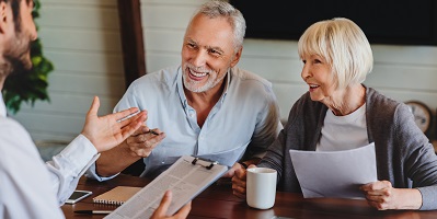 Retired couple meeting with financial professional